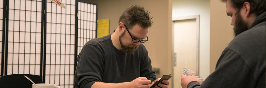 Our Support Analyst playing cards at lunch.